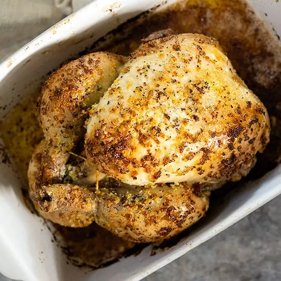 Hele kip uit de oven met knoflookboter