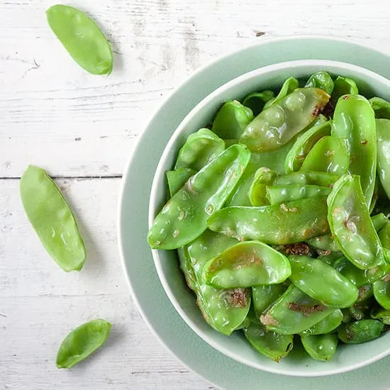 Recept: Peultjes met knoflook en gember uit de wok